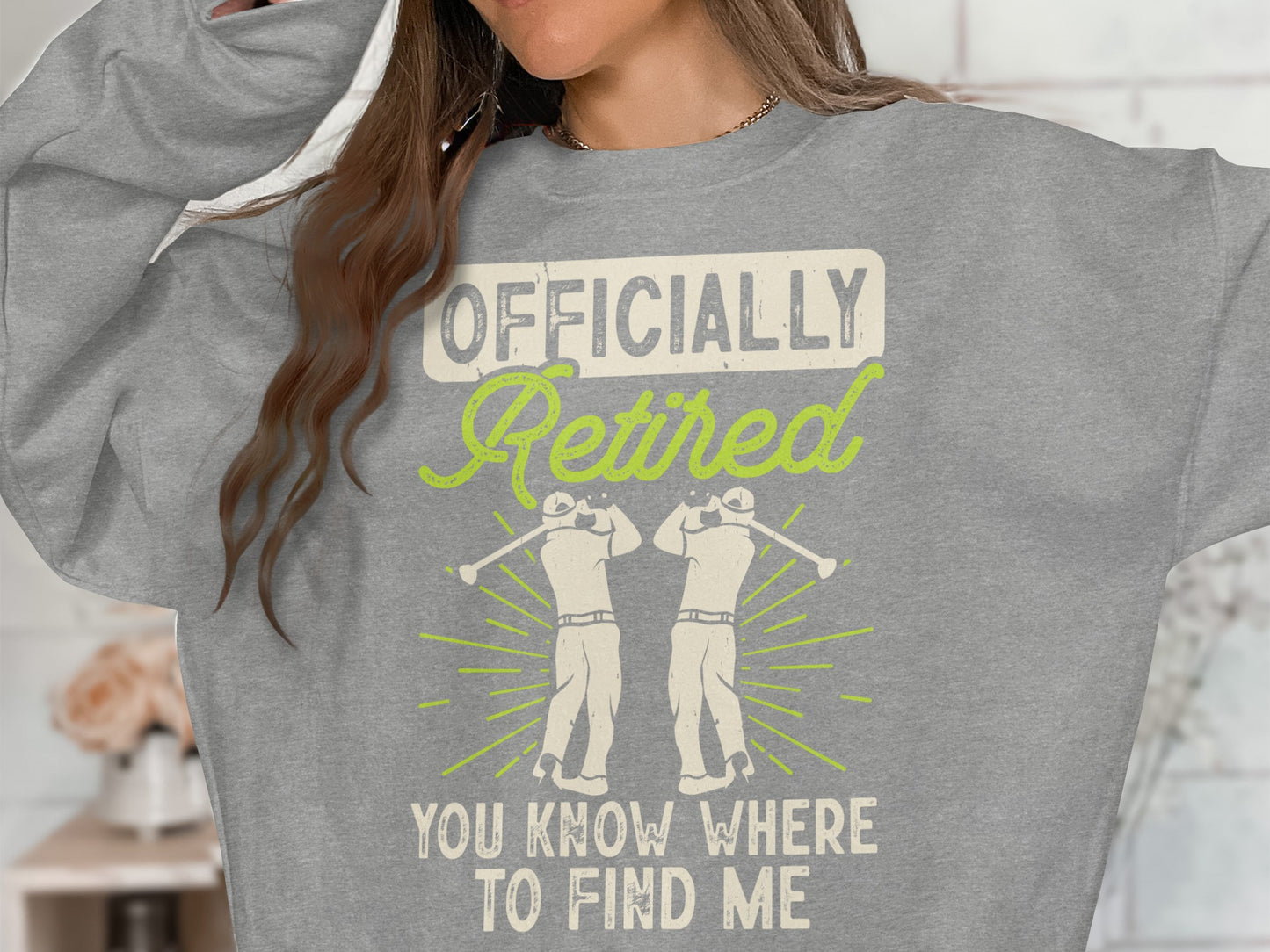 Gray sweatshirt with "Officially Retired" and two golfers.