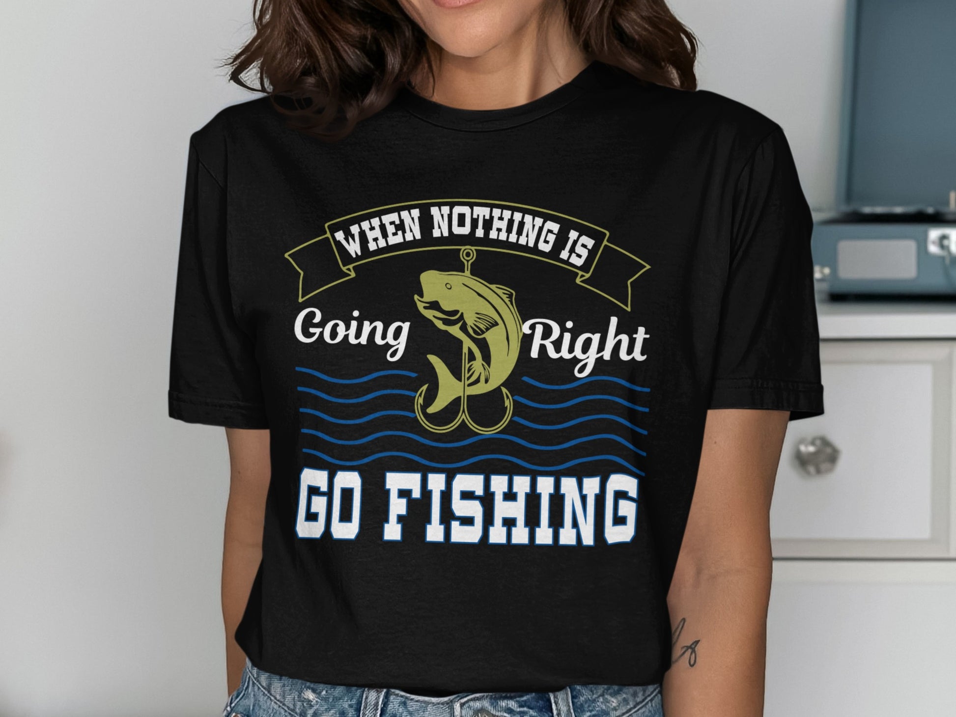Black t-shirt with "When Nothing Is Right Go Fishing" text and a fishhook graphic.