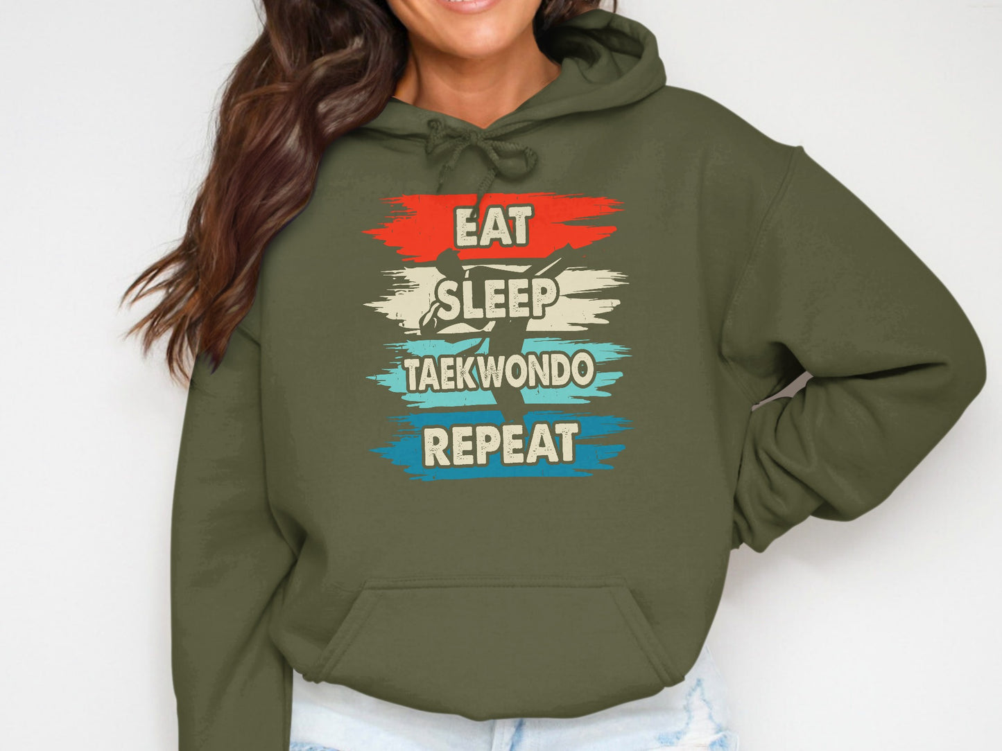 Olive green hoodie with "Eat Sleep Taekwondo Repeat" text in red, white, and blue.