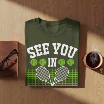 Green t-shirt with "See You In" and tennis rackets.