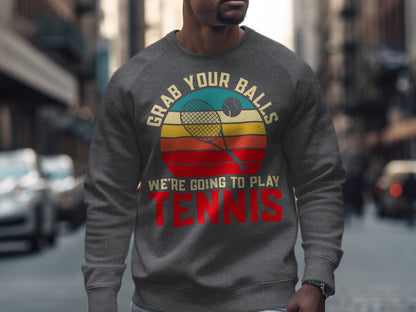 Gray sweatshirt with circular graphic: "Grab Your Balls, We're Going To Play Tennis."