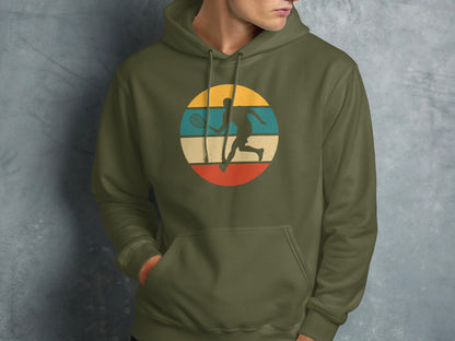 Green hoodie with circular graphic of a tennis player and vintage stripes.