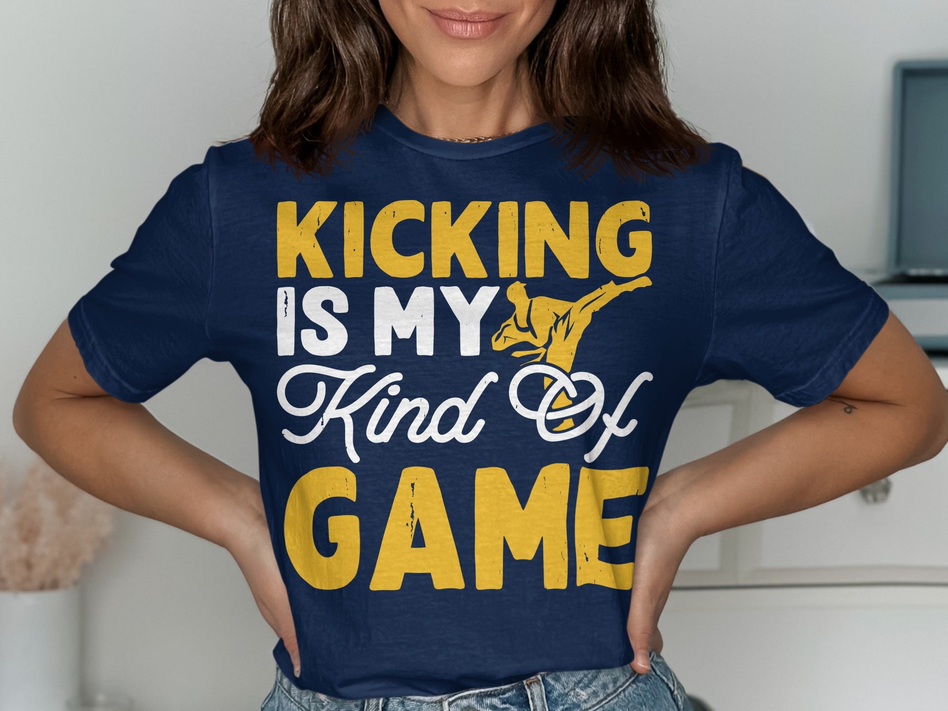 Navy t-shirt with "Kicking Is My Kind Of GAME" and a martial artist graphic.