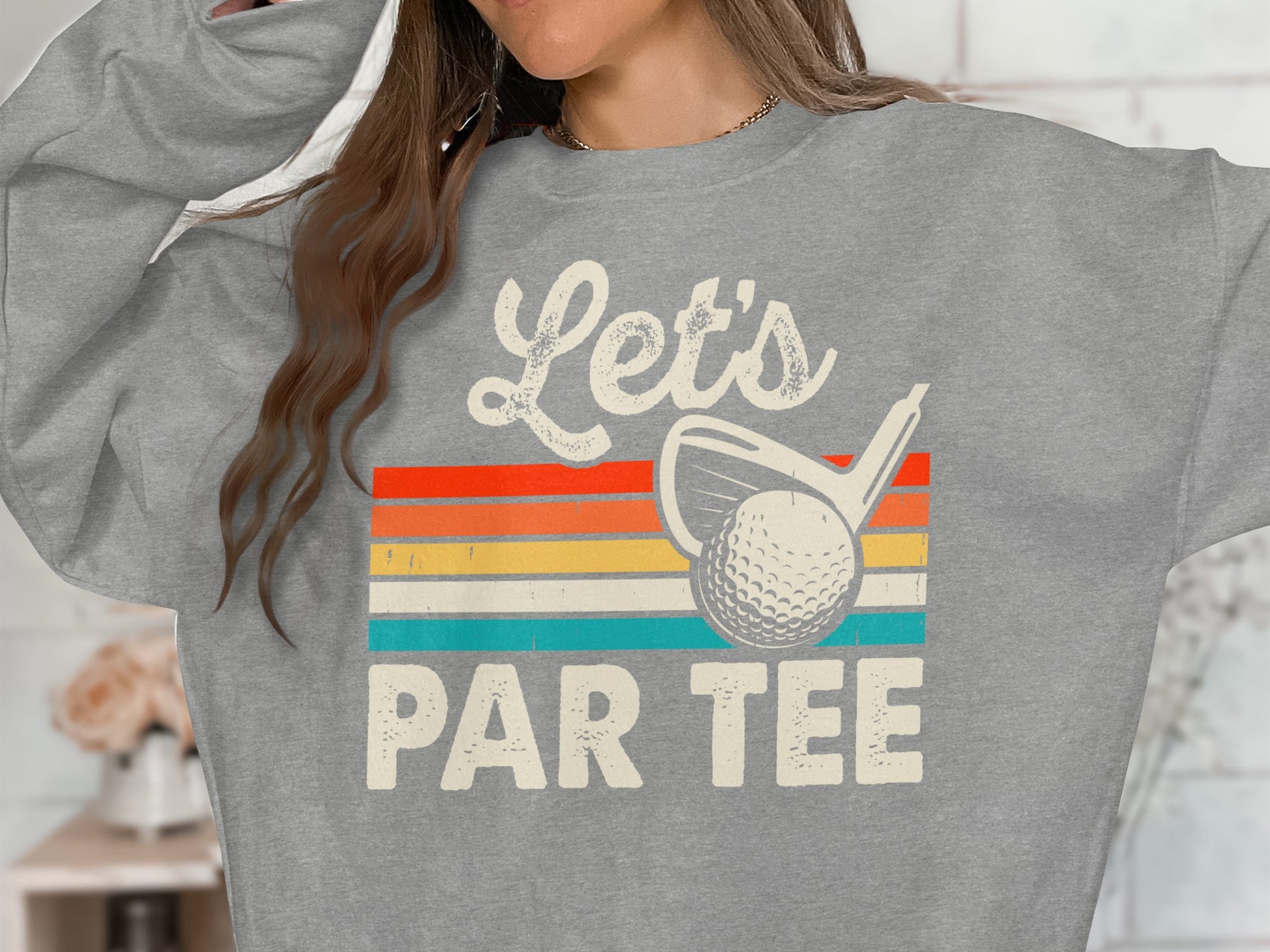 Gray sweatshirt with "Let's Par Tee" text and a golf club and ball.