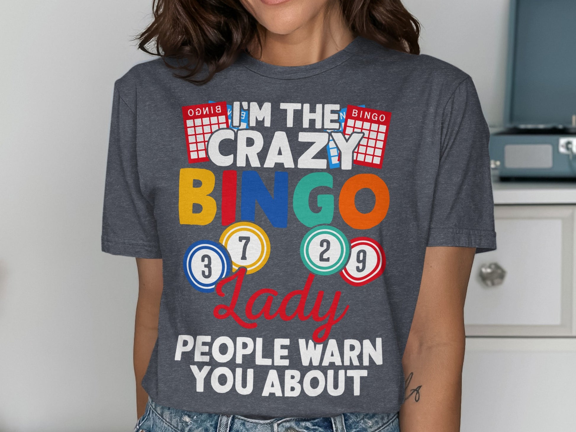 Dark gray t-shirt with "I'm the crazy Bingo lady" text and bingo balls.