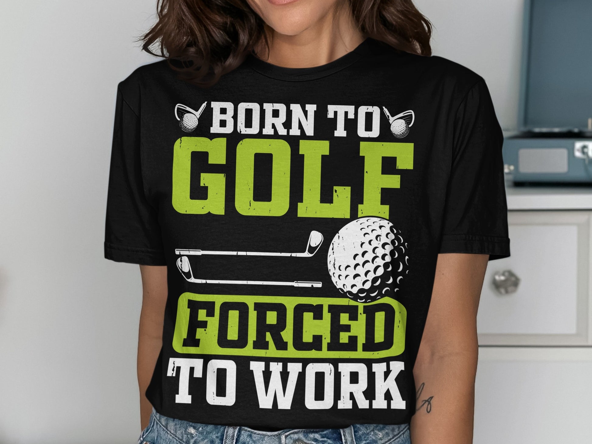 Black t-shirt with "Born to Golf Forced to Work" text and golf imagery.
