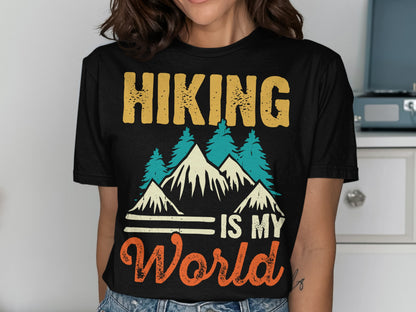 Black t-shirt with "Hiking is my world" text and mountain graphic.