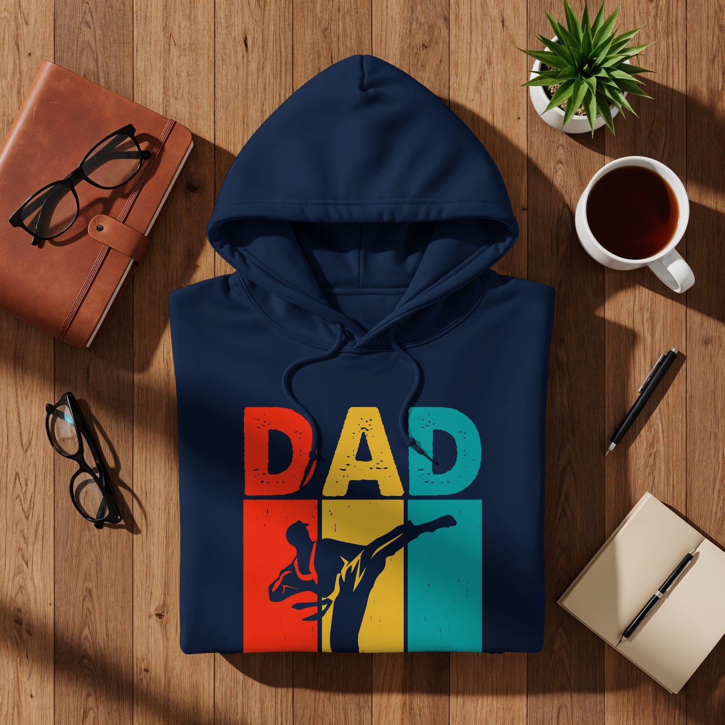 Navy blue hoodie with "DAD" text and a martial artist silhouette.