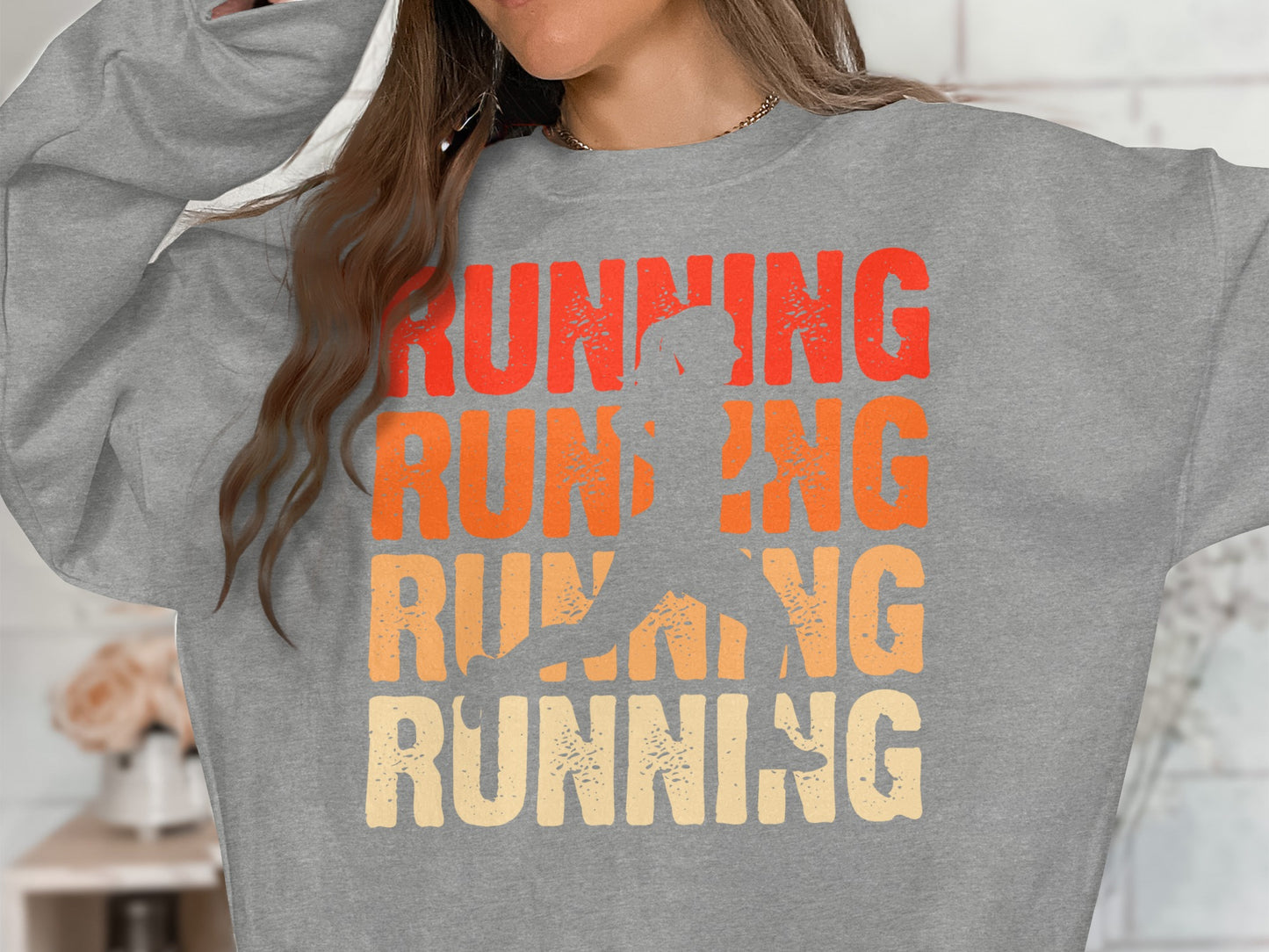 Grey sweatshirt with "RUNNING" text and silhouette of a runner.