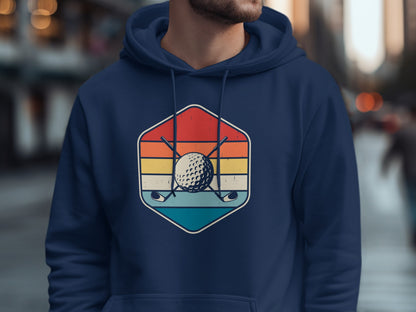 Hexagon logo with golf ball, clubs, and striped background.