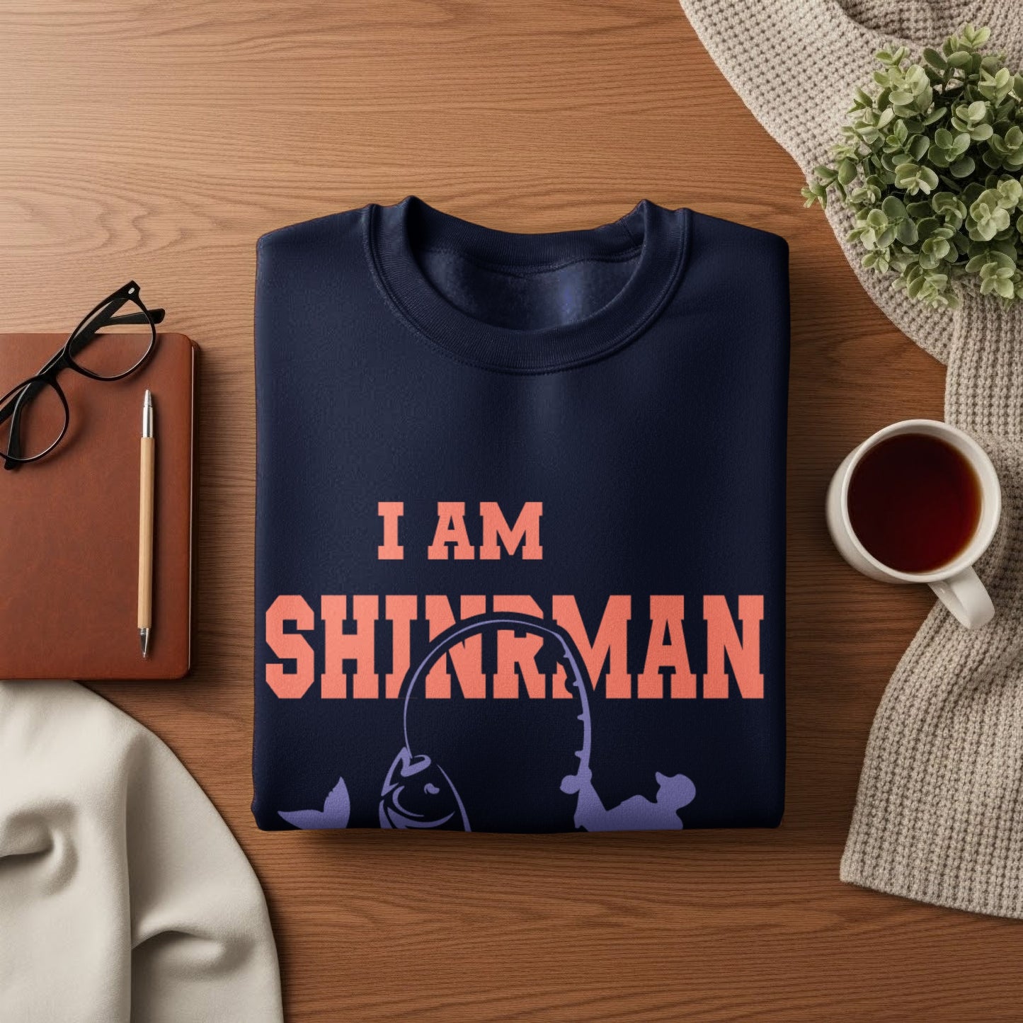 Dark blue sweatshirt with "I AM SHRINKMAN" and fishing graphic.