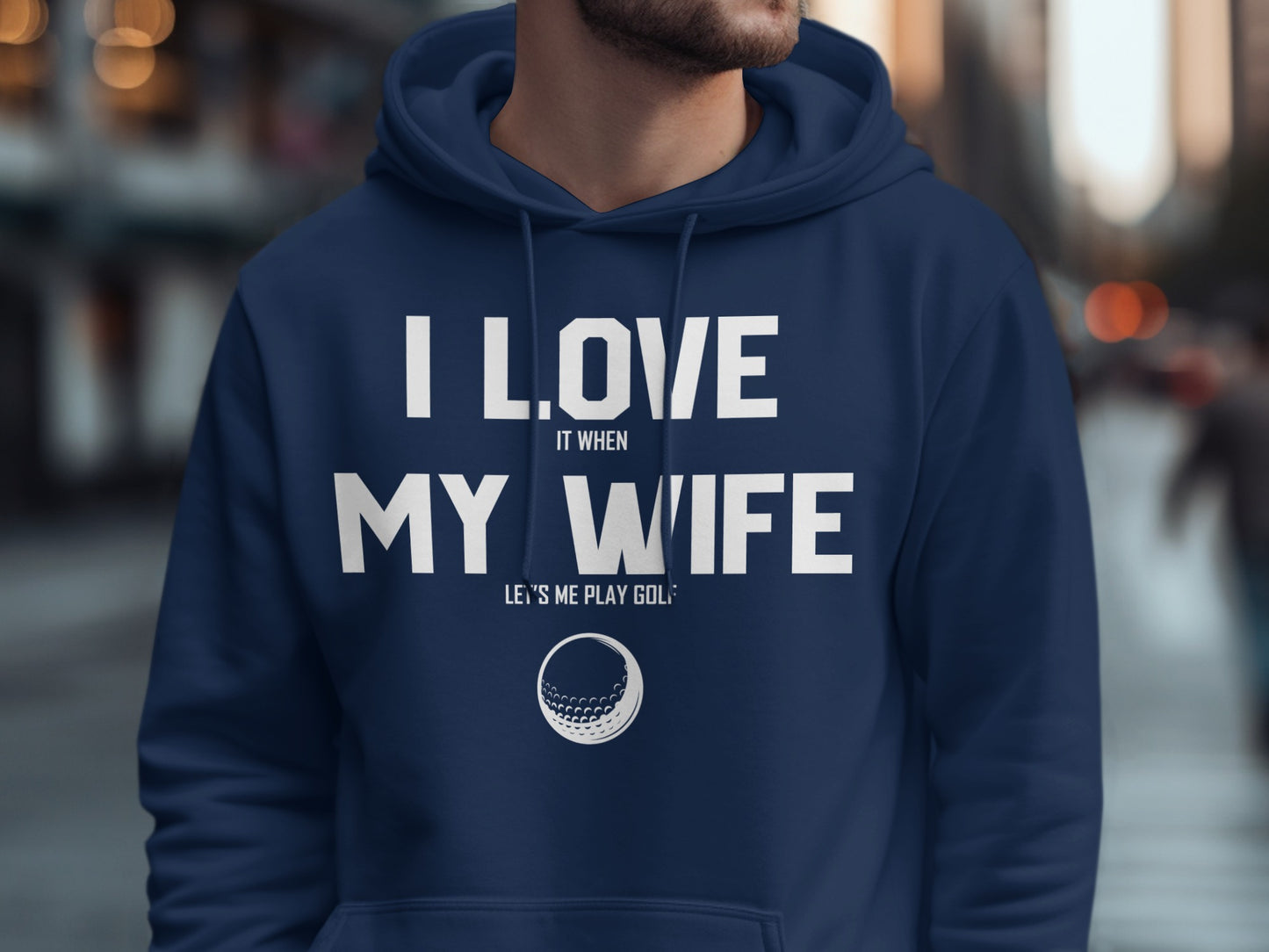 Navy hoodie with "I love my wife when she lets me play golf" text.