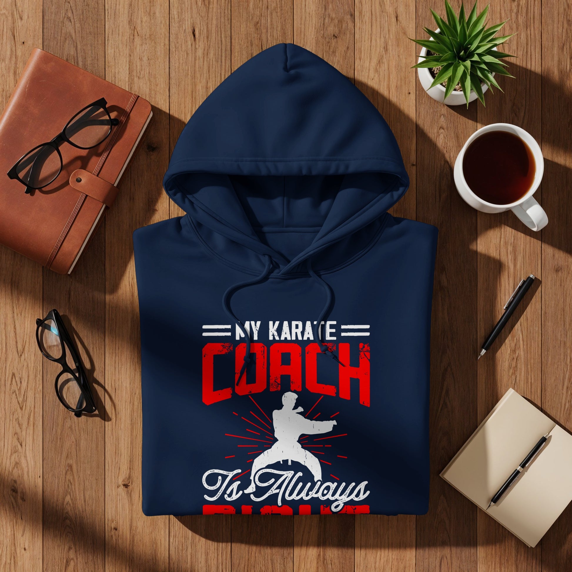 Navy hoodie with "My Karate Coach is Always Right" text.