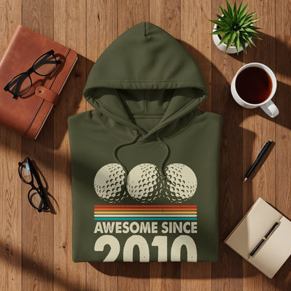 Olive green hoodie with "Awesome Since 2010" and three golf balls.