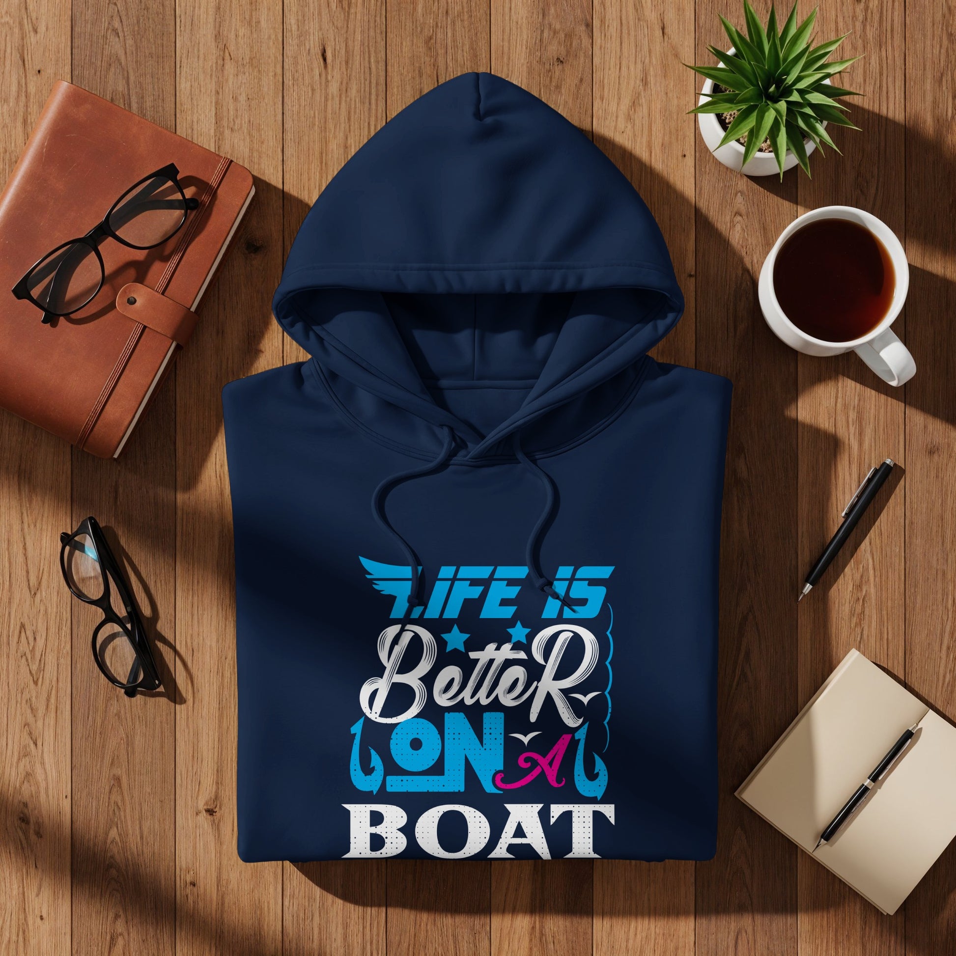 Navy blue hoodie with "Life is Better on a Boat" text design.