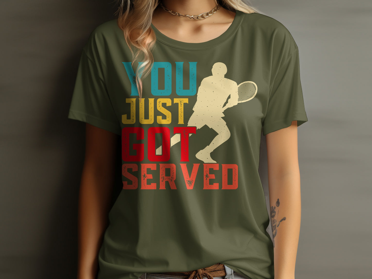 Green t-shirt with vintage tennis player graphic and text "YOU JUST GOT SERVED".
