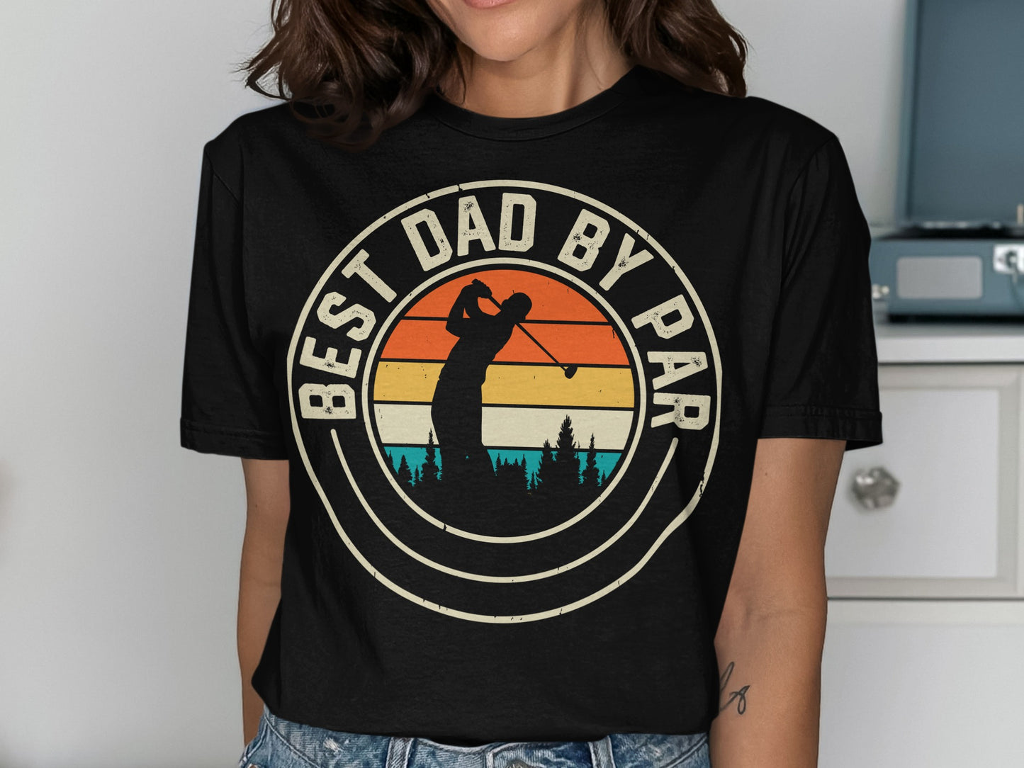 T-shirt with "Best Dad By Par" text and silhouette of a golfer.