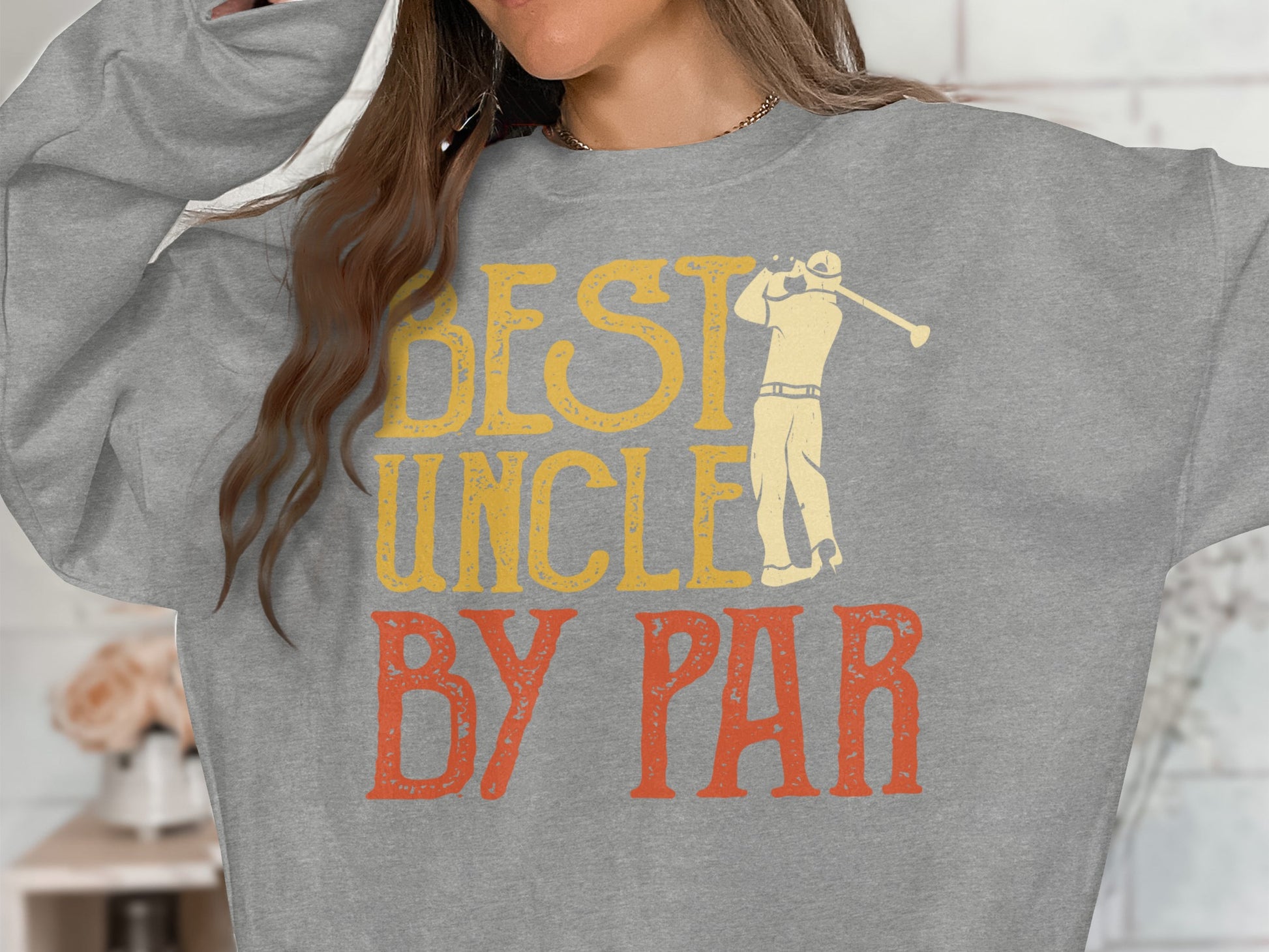 Grey sweatshirt with "BEST UNCLE BY PAR" text and golfer graphic.