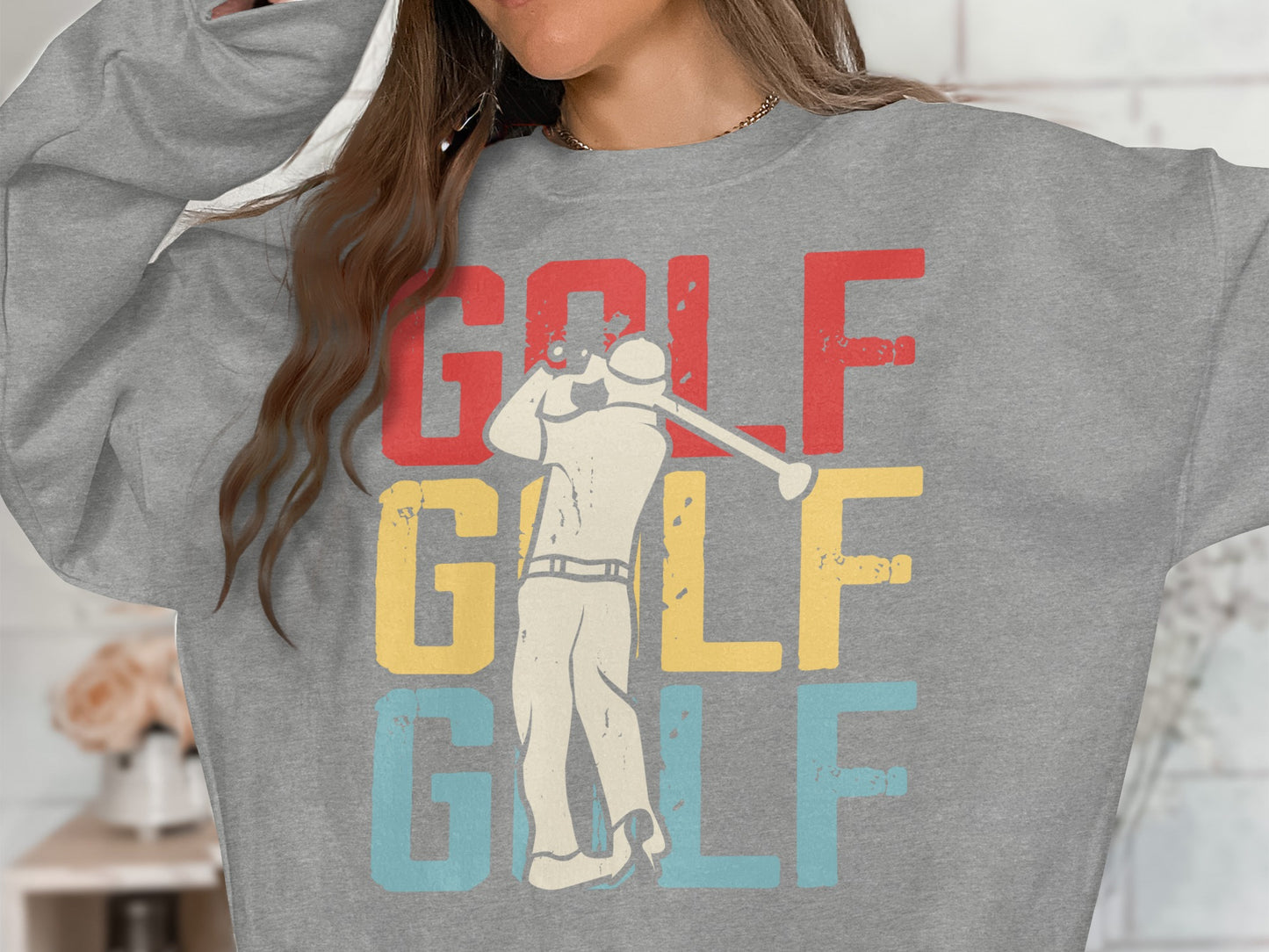 Grey sweatshirt with "GOLF GOLF GOLF" and golfer graphic.