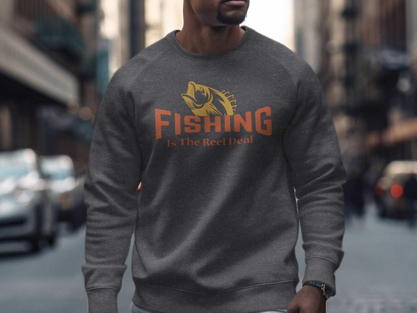 Dark grey sweatshirt with orange fish and "Fishing Is The Reel Deal" text.