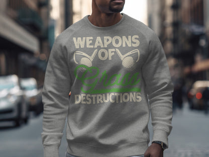 Grey sweatshirt with "WEAPONS OF DESTRUCTIONS" text and golf club graphic.