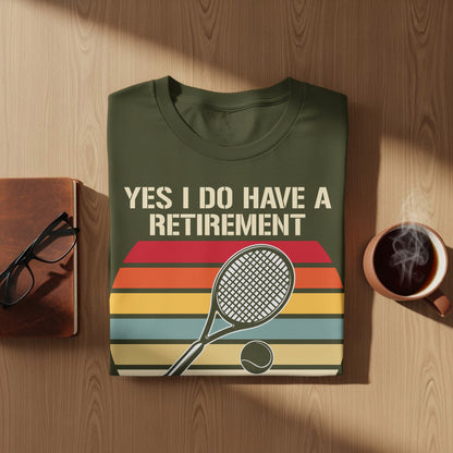 Olive green t-shirt with "YES I DO HAVE A RETIREMENT" and tennis racket graphic.