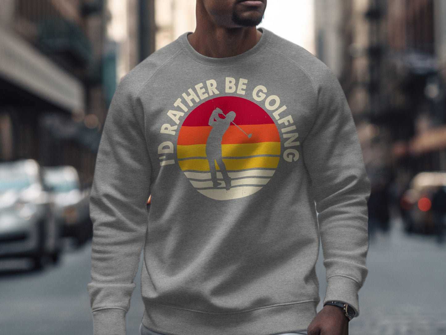 Gray sweatshirt with "I'd rather be golfing" text and sunset golfer graphic.