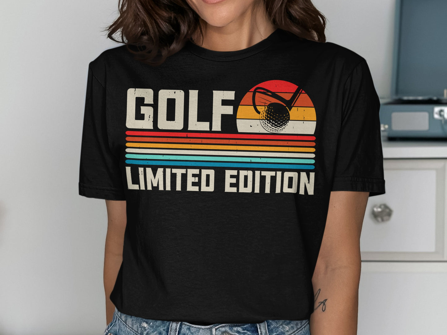Black t-shirt with "GOLF LIMITED EDITION" text and vintage golf ball and sunset graphic.