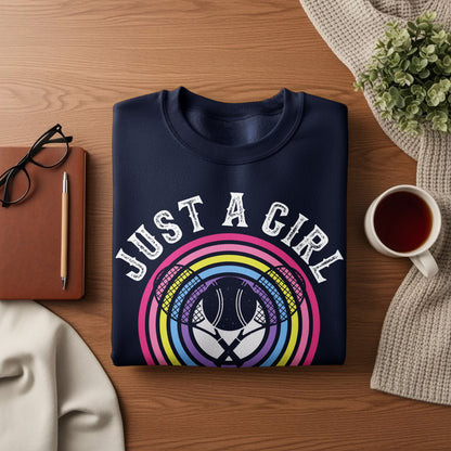 Navy sweatshirt with "Just a Girl" text and tennis rackets on a rainbow.