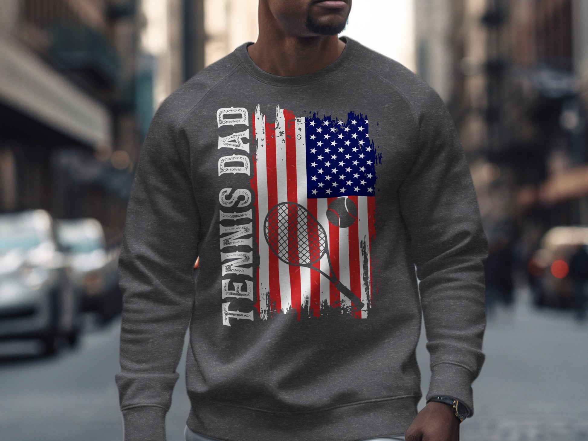 Sweatshirt with distressed US flag, tennis racket, ball, and "Tennis Dad" text.