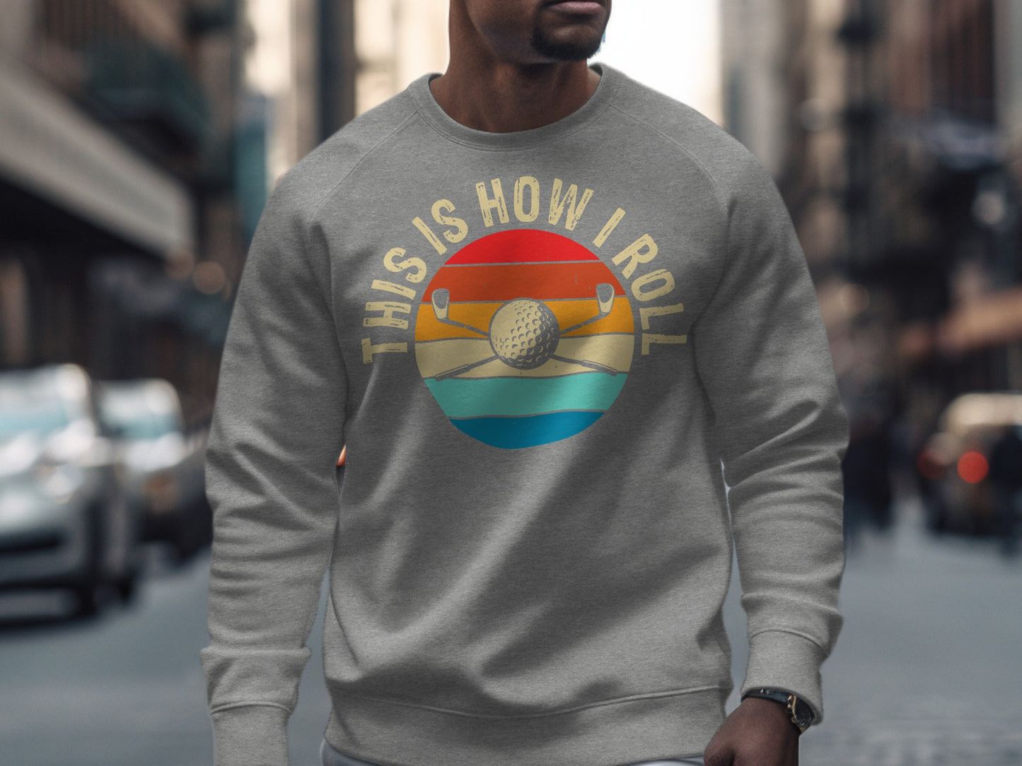 Grey sweatshirt with "This Is How I Roll" and golf club graphic.