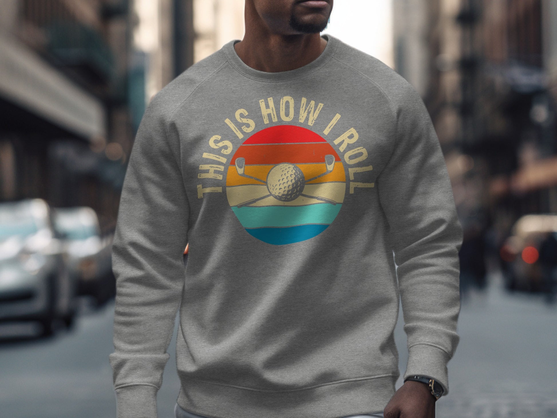 Grey sweatshirt with "This Is How I Roll" and golf club graphic.