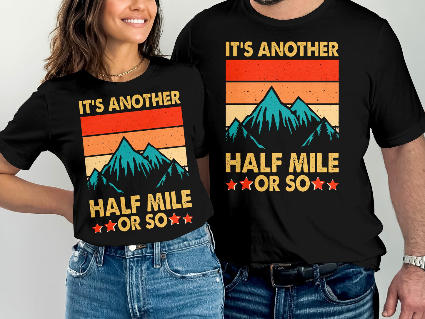 T-shirts with mountains and text "It's Another Half Mile or So".