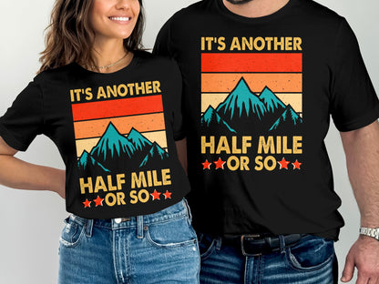 T-shirts with mountains and text "It's Another Half Mile or So".