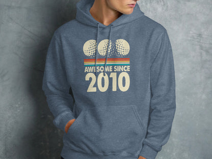 Blue hoodie with "Awesome Since 2010" and three golf balls graphic.