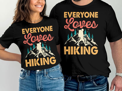 Couple wearing matching black t-shirts with "Everyone Loves Hiking" text.