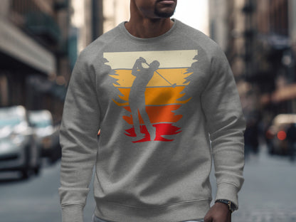 Gray sweatshirt with golfer silhouette against sunset stripes.