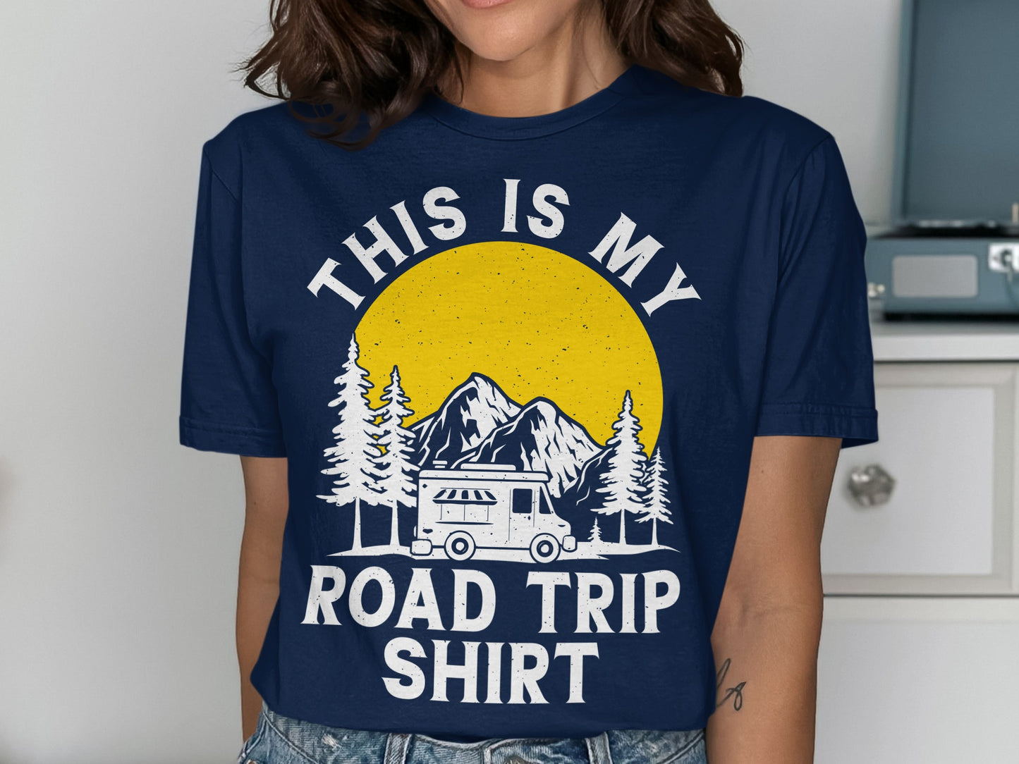Dark blue t-shirt with "THIS IS MY ROAD TRIP SHIRT" text and camping scene.