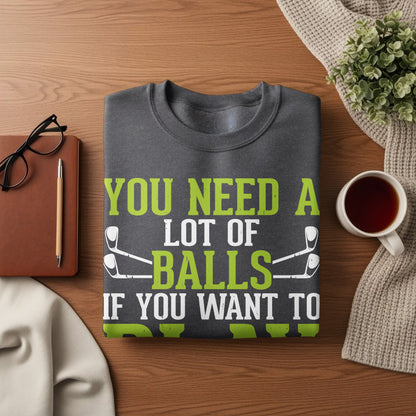 Dark gray t-shirt with green text: "YOU NEED A LOT OF BALLS IF YOU WANT TO PLAY GOLF".