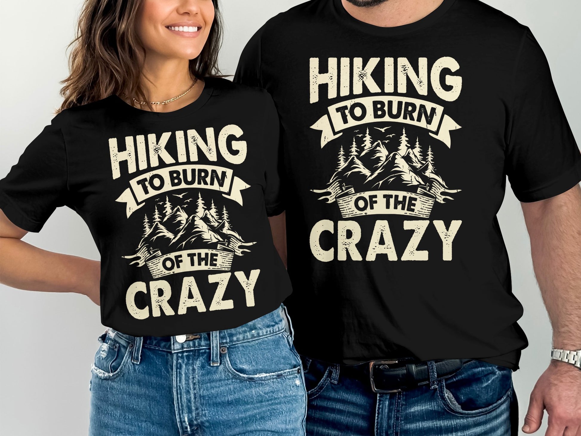 Couple wearing matching "Hiking to Burn of the Crazy" t-shirts.