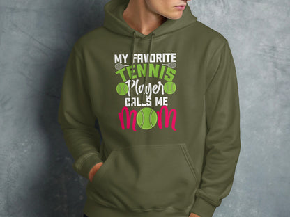 Green hoodie with text "My Favorite Tennis Player Calls Me Mom" and tennis balls.