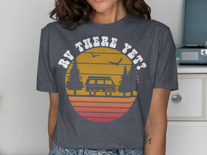 RV THERE YET? graphic on a dark gray t-shirt with retro sunset and trees.