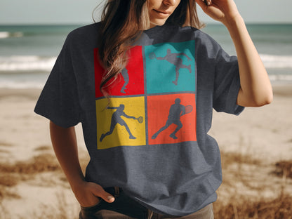 T-shirt with four colorful squares depicting badminton players in action.