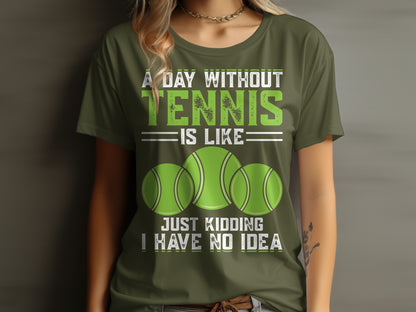 Green t-shirt with "A Day Without Tennis is Like Just Kidding I Have No Idea" and tennis balls.