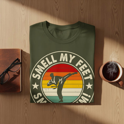 Olive green t-shirt with "Snell My Feet In" and karate silhouette.