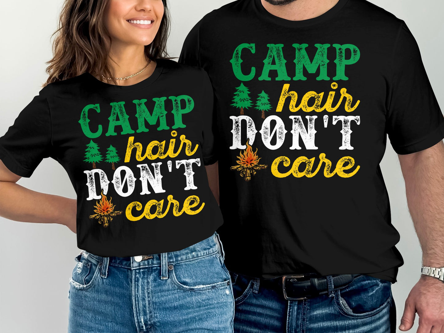 Two people wear black t-shirts with "CAMP HAIR DON'T CARE" text and camping graphics.