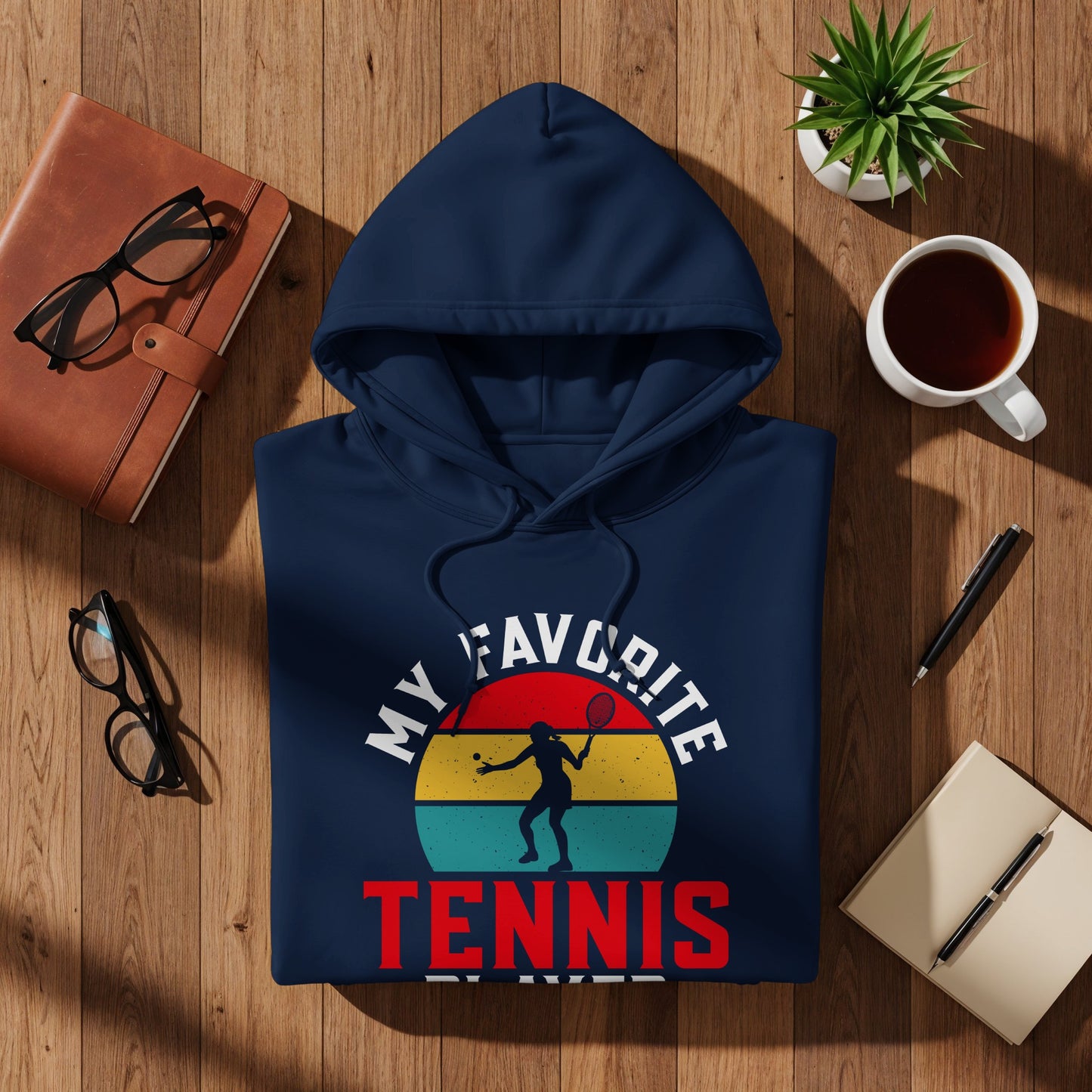 Navy hoodie with "My Favorite Player Tennis" text and tennis player graphic.