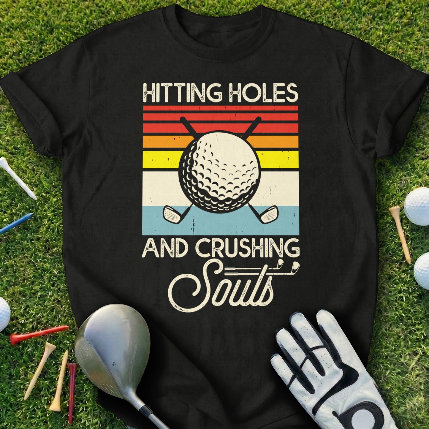 Black t-shirt with "Hitting Holes and Crushing Souls" and golf imagery.