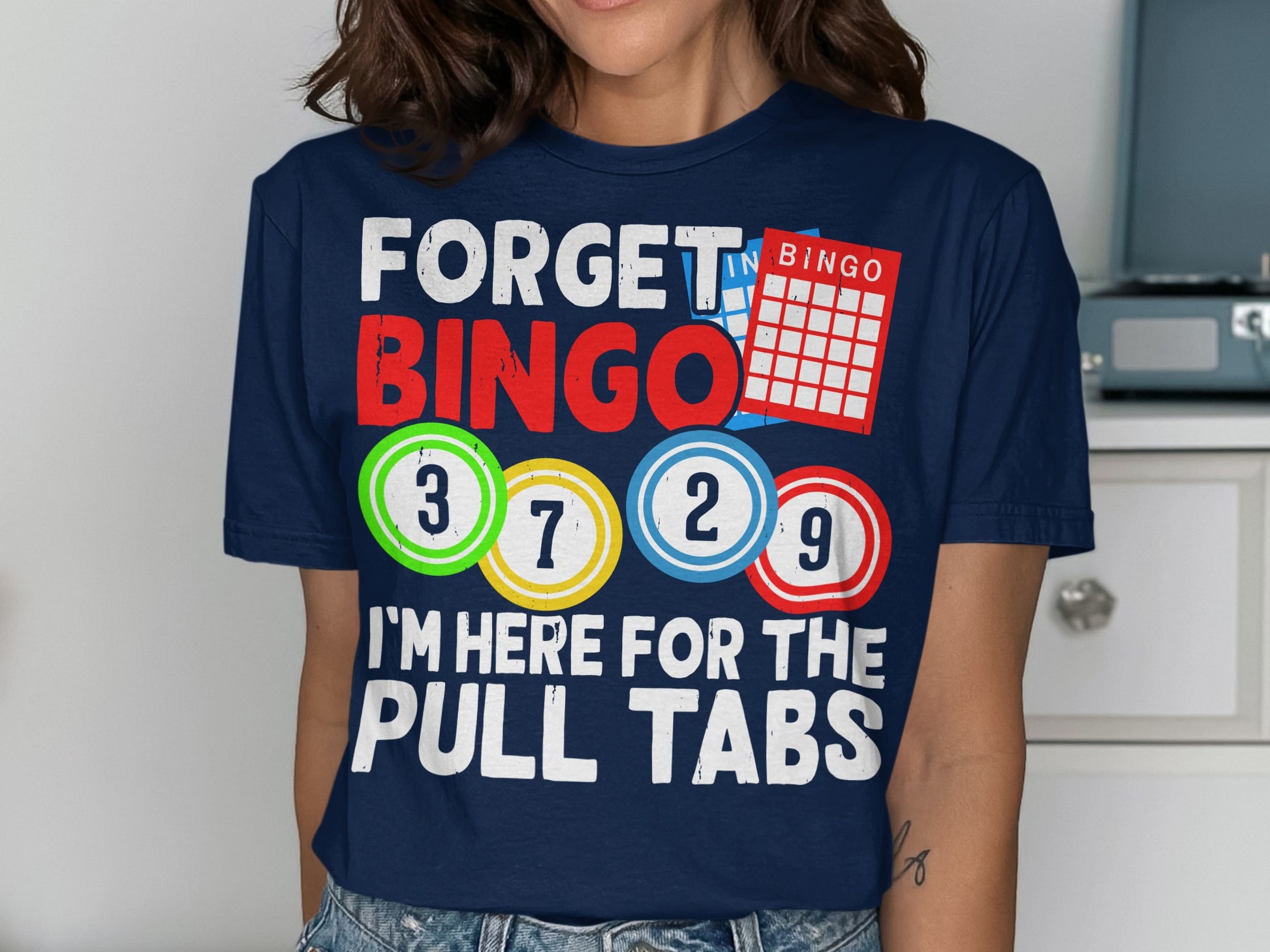 Navy t-shirt with "FORGET BINGO I'M HERE FOR THE PULL TABS" and bingo balls.