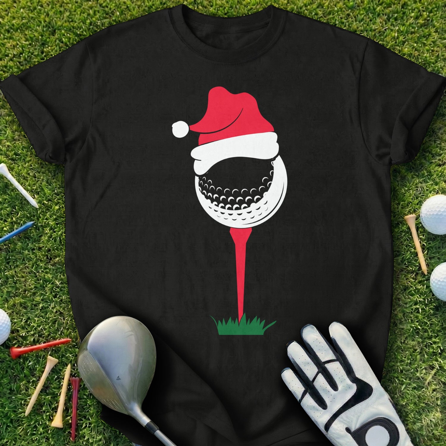 Black t-shirt with a Christmas-themed golf ball on a tee.